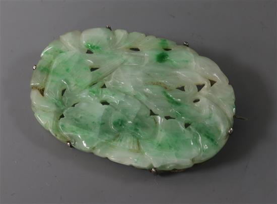 A Chinese white metal mounted carved jadeite brooch, 50mm.